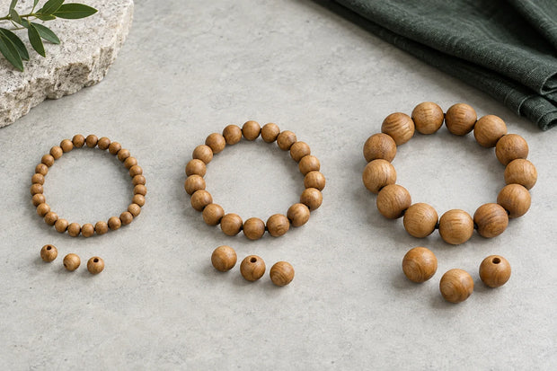 Illustrative wooden bead strands showing small, medium and larger bead proportions