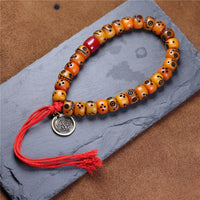 Tibetan Yak Bone Carved Smiley Bracelet – Handcrafted Yellow God of Wealth Mala for Blessing & Collection - Buddhabelief