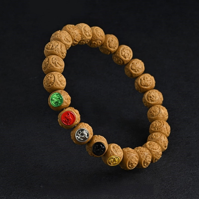 Four Symbols Taoist Bracelet – 10mm carved monkey head beads with Four Celestial Beasts. Monk-blessed for spiritual protection & cosmic harmony