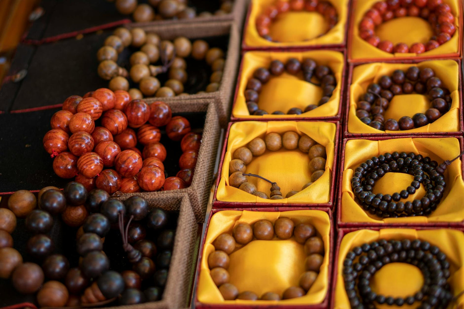 taoism bracelet - Close-up of colorful wooden bead bracelets in decorative boxes. | Buddhabelief