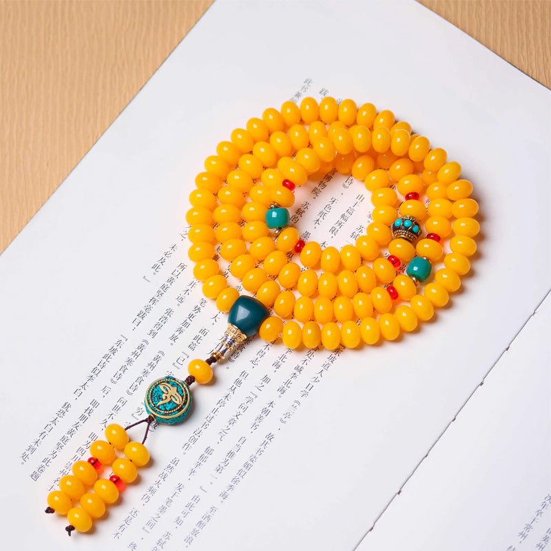 Tibetan yellow amber prayer beads 108 mala with turquoise and coral accents for meditation and protection