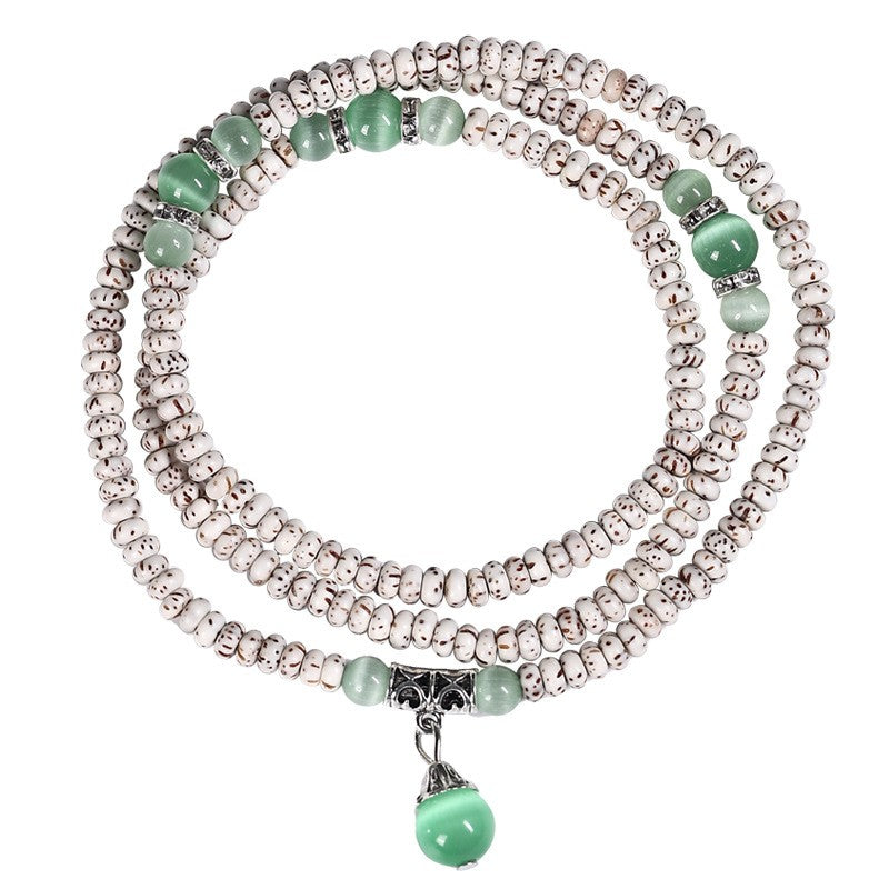 Complete star-and-moon bodhi wrap with green accents and hanging bead