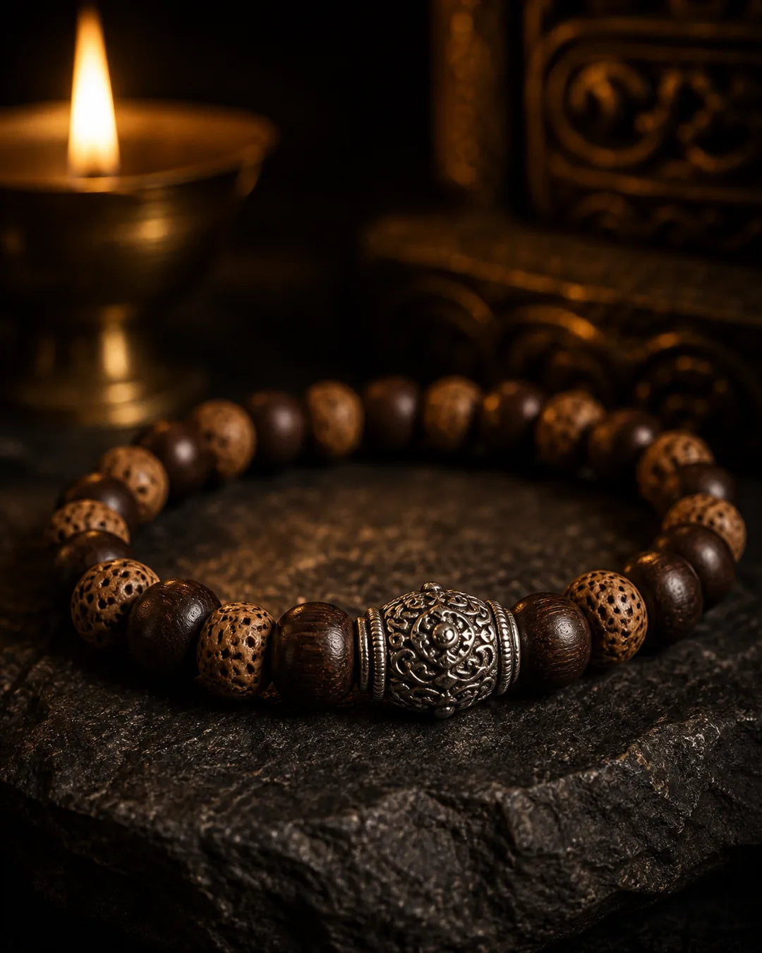 Tibetan sandalwood prayer-bead bracelet with a carved silver bead