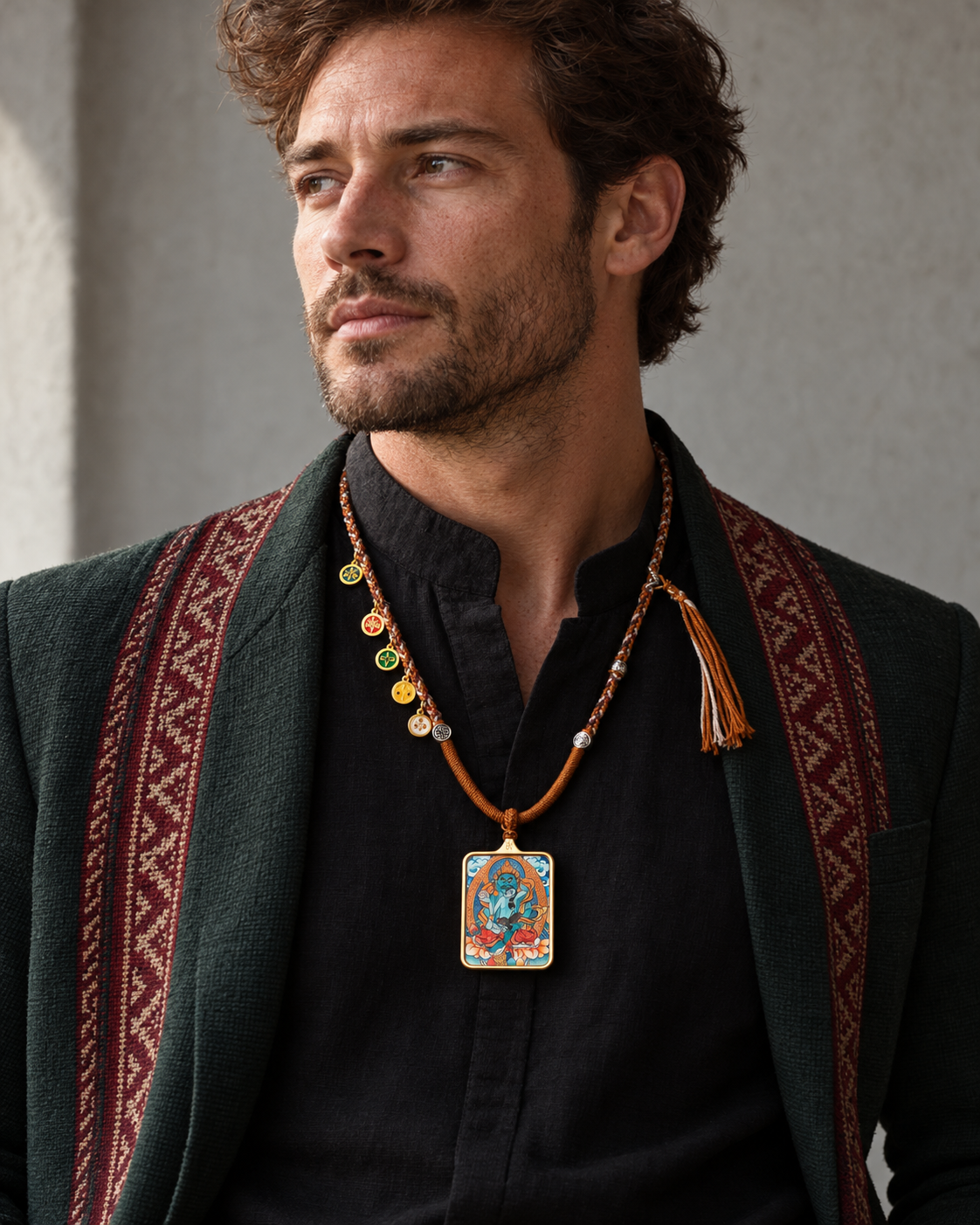 Editorial model wearing a framed thangka pendant